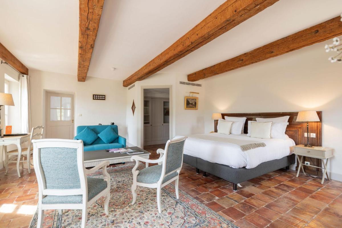Un ou plusieurs lits dans un hébergement de l'établissement Hôtel - Restaurant & Spa La Magdeleine - Mathias Dandine