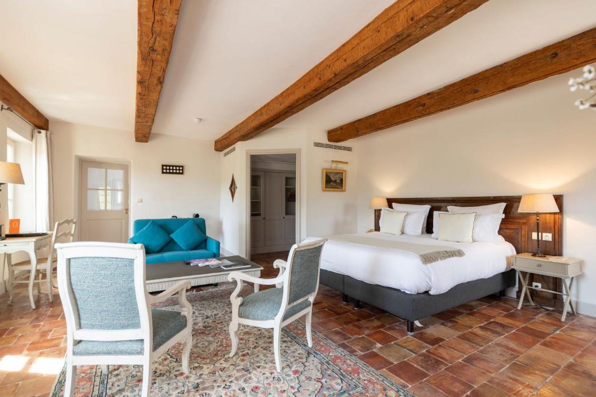 Un ou plusieurs lits dans un hébergement de l'établissement Hôtel - Restaurant & Spa La Magdeleine - Mathias Dandine