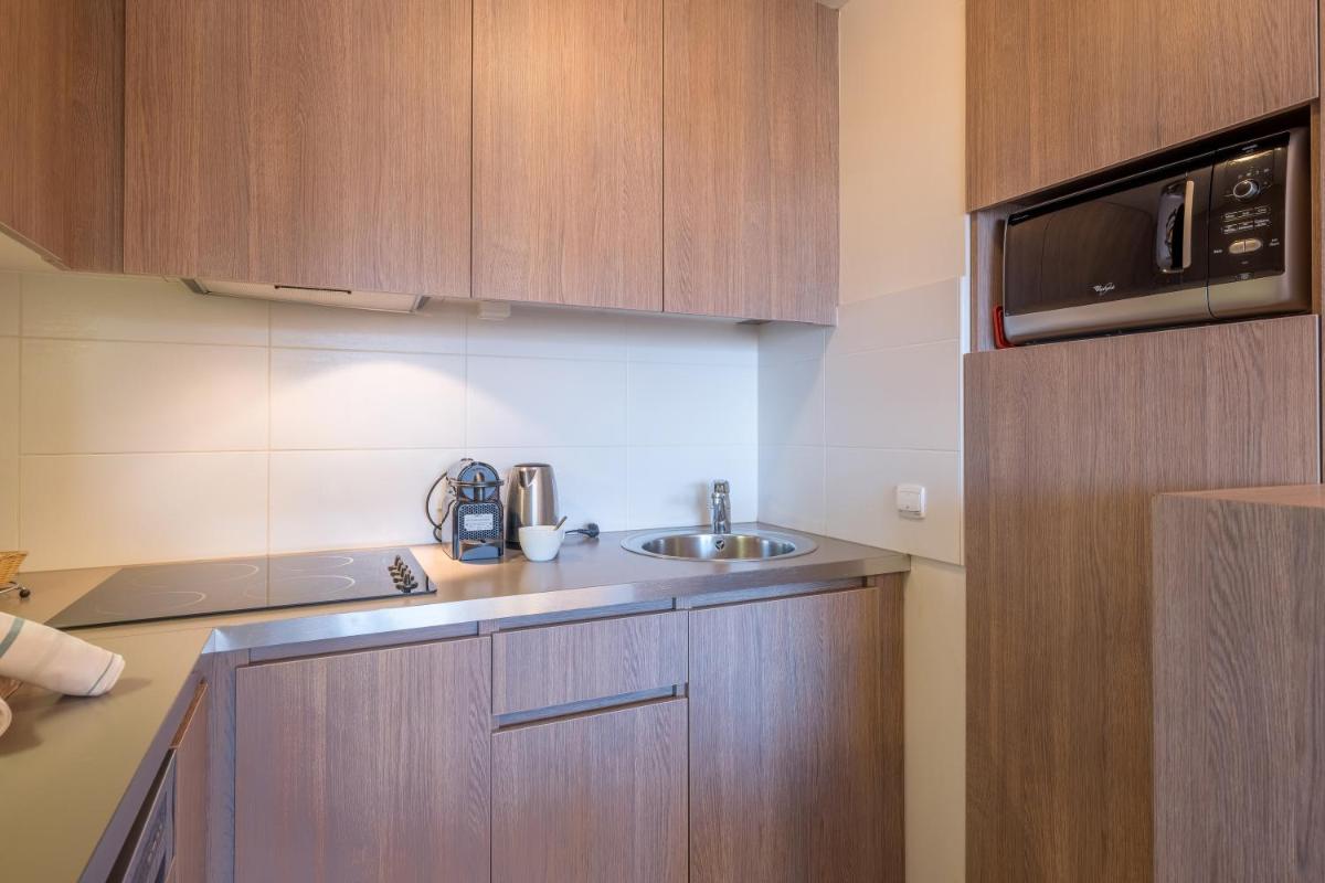 Cuisine ou kitchenette dans l'établissement Résidence Pierre & Vacances Atria-Crozats