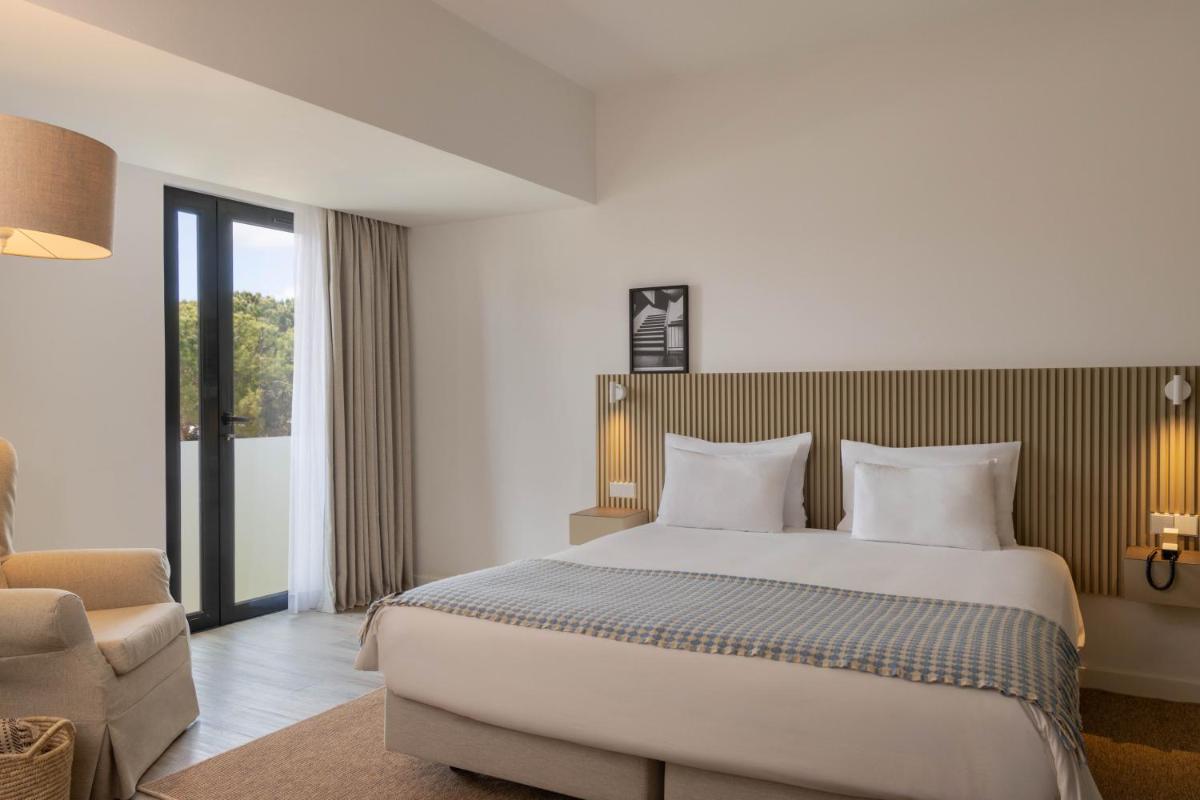 Uma cama ou camas num quarto em Memmo Baleeira - Design Hotels