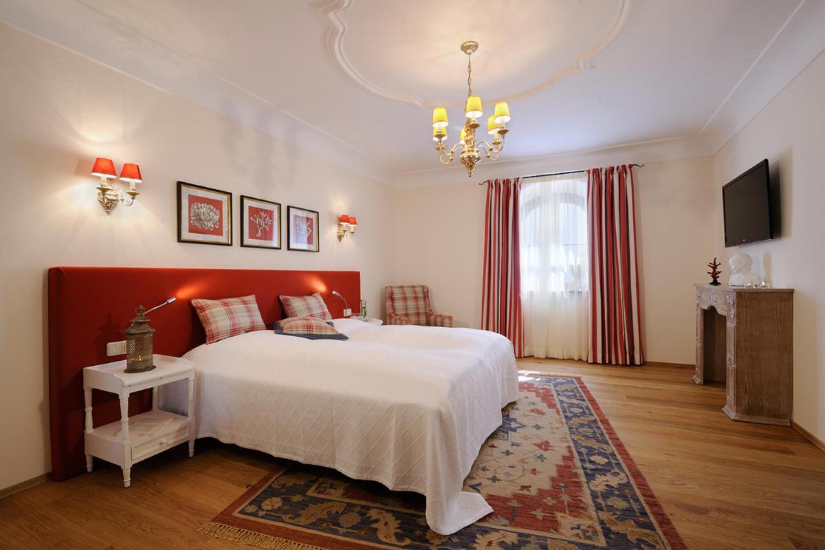 Ein Bett oder Betten in einem Zimmer der Unterkunft Hotel Gut Ising