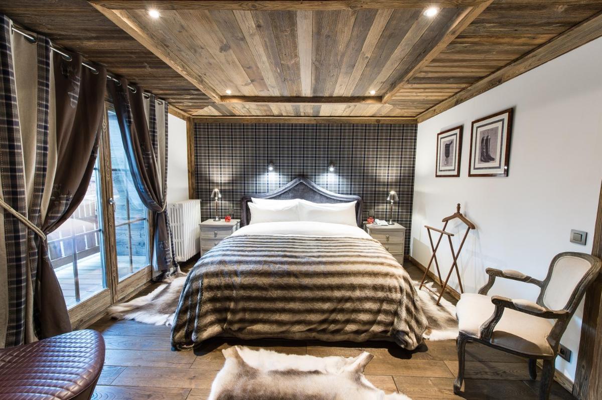 Un ou plusieurs lits dans un hébergement de l'établissement Le Chalet Blanc