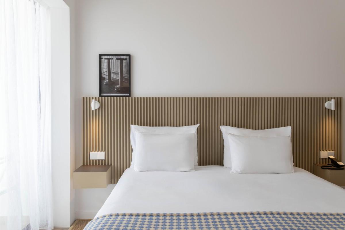 Uma cama ou camas num quarto em Memmo Baleeira - Design Hotels