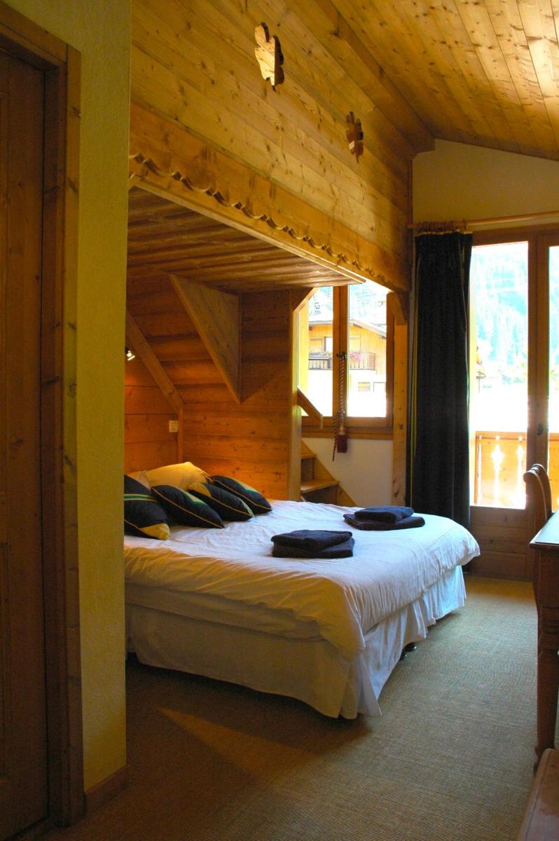 Un ou plusieurs lits dans un hébergement de l'établissement Hôtel et Chalet Au Coin Du Feu Chilly Powder