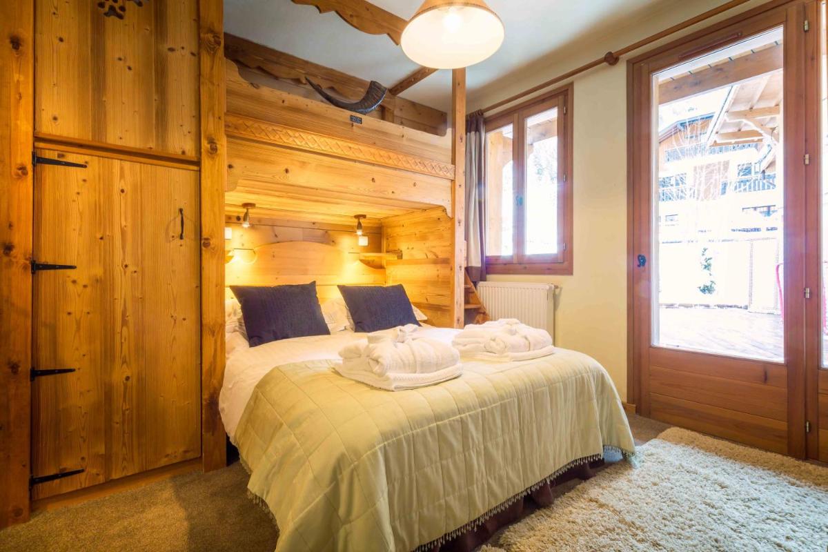 Un ou plusieurs lits dans un hébergement de l'établissement Hôtel et Chalet Au Coin Du Feu Chilly Powder