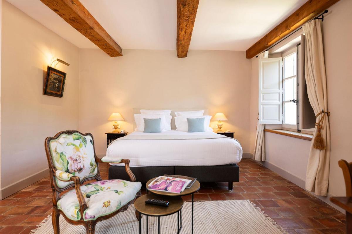 Un ou plusieurs lits dans un hébergement de l'établissement Hôtel - Restaurant & Spa La Magdeleine - Mathias Dandine