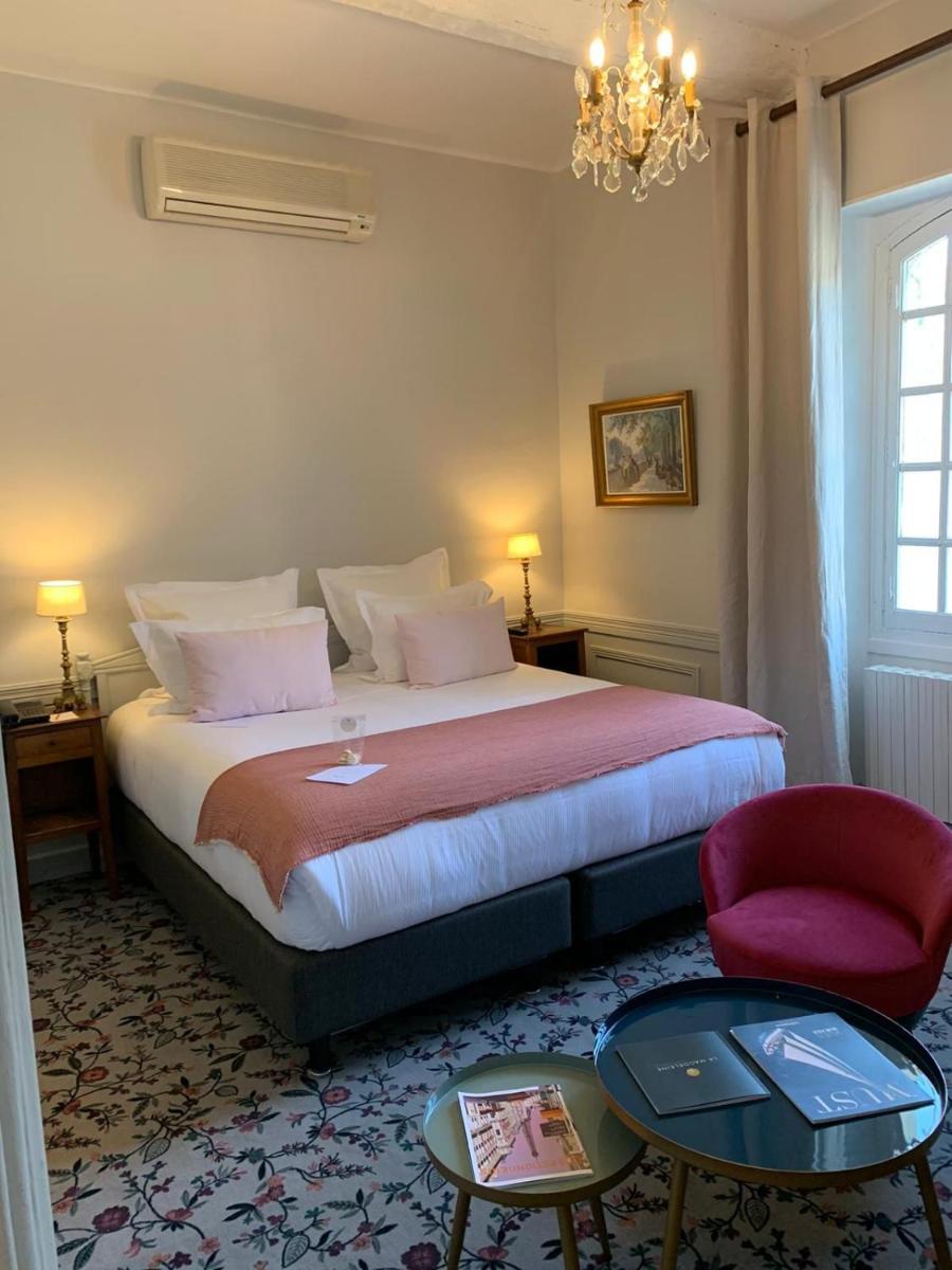 Un ou plusieurs lits dans un hébergement de l'établissement Hôtel - Restaurant & Spa La Magdeleine - Mathias Dandine