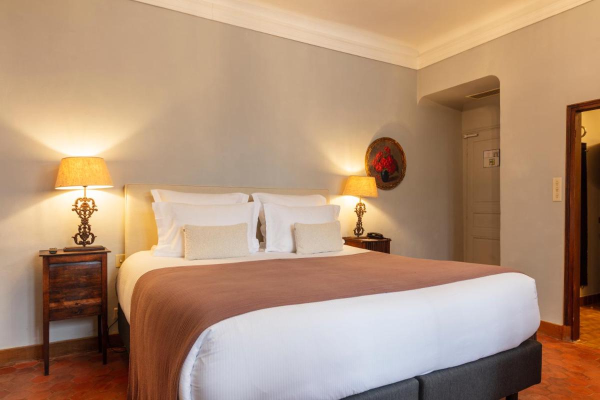 Un ou plusieurs lits dans un hébergement de l'établissement Hôtel - Restaurant & Spa La Magdeleine - Mathias Dandine