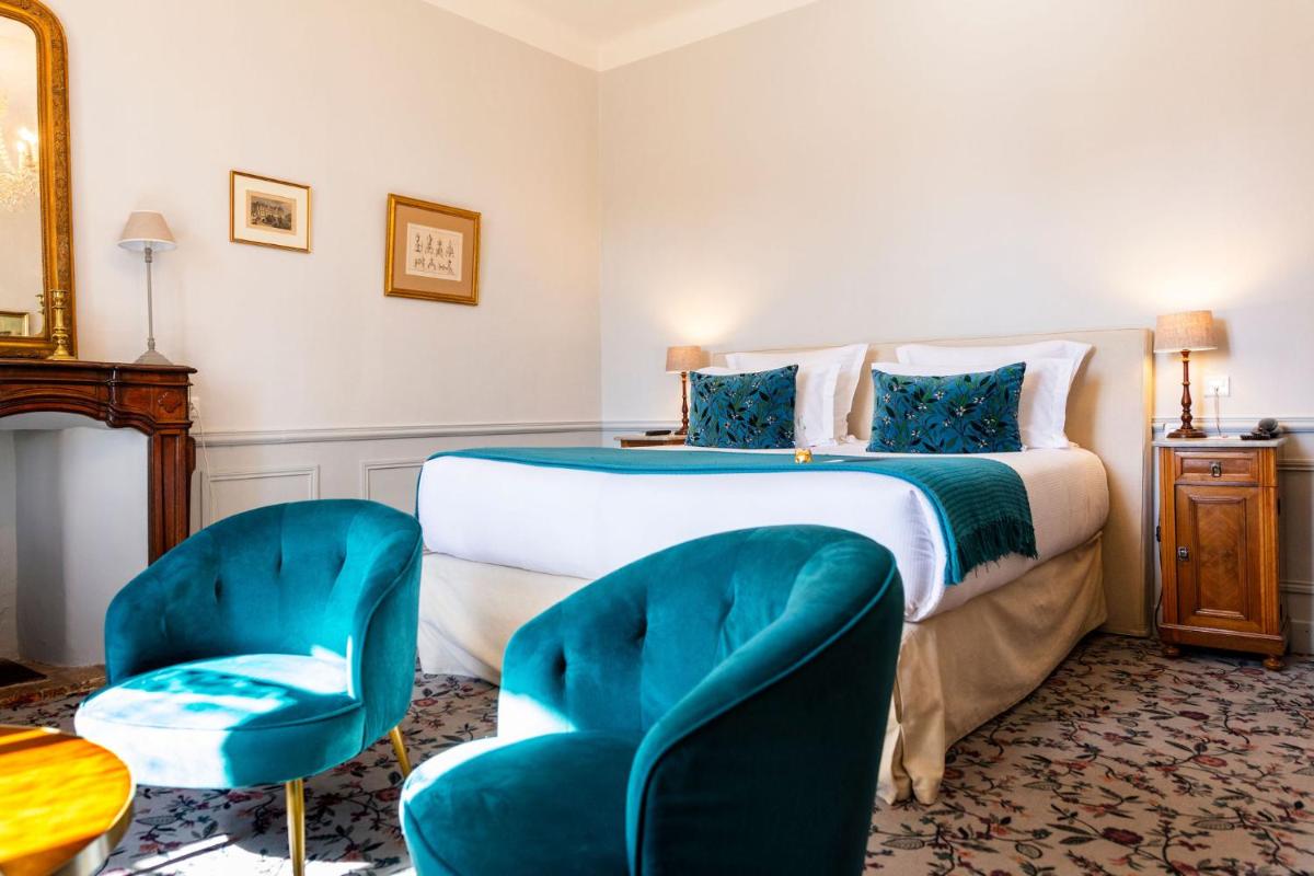 Un ou plusieurs lits dans un hébergement de l'établissement Hôtel - Restaurant & Spa La Magdeleine - Mathias Dandine