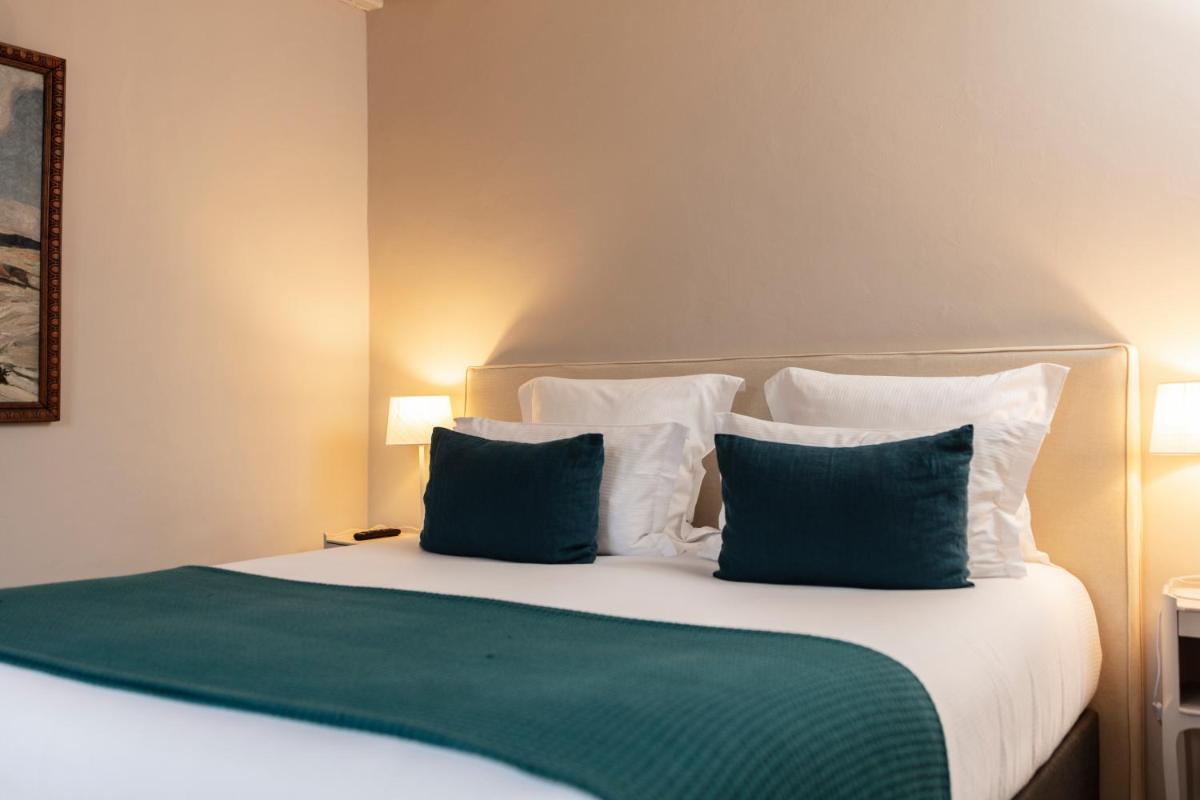 Un ou plusieurs lits dans un hébergement de l'établissement Hôtel - Restaurant & Spa La Magdeleine - Mathias Dandine