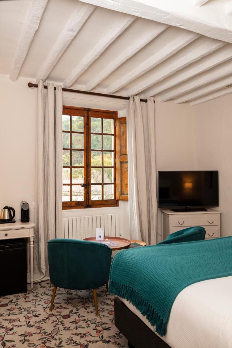 Un ou plusieurs lits dans un hébergement de l'établissement Hôtel - Restaurant & Spa La Magdeleine - Mathias Dandine