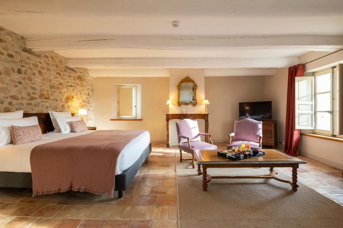 Un ou plusieurs lits dans un hébergement de l'établissement Hôtel - Restaurant & Spa La Magdeleine - Mathias Dandine