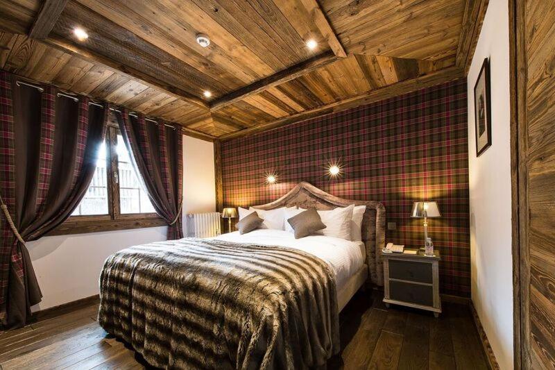 Un ou plusieurs lits dans un hébergement de l'établissement Le Chalet Blanc