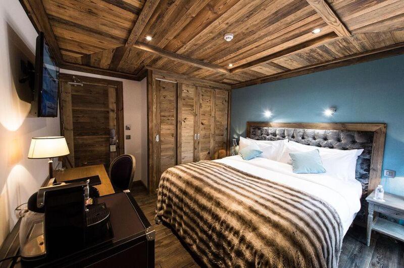 Un ou plusieurs lits dans un hébergement de l'établissement Le Chalet Blanc