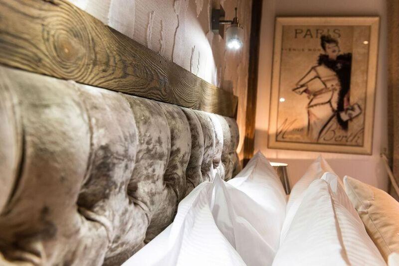 Un ou plusieurs lits dans un hébergement de l'établissement Le Chalet Blanc
