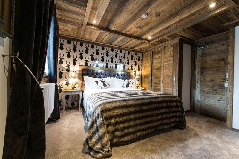 Un ou plusieurs lits dans un hébergement de l'établissement Le Chalet Blanc