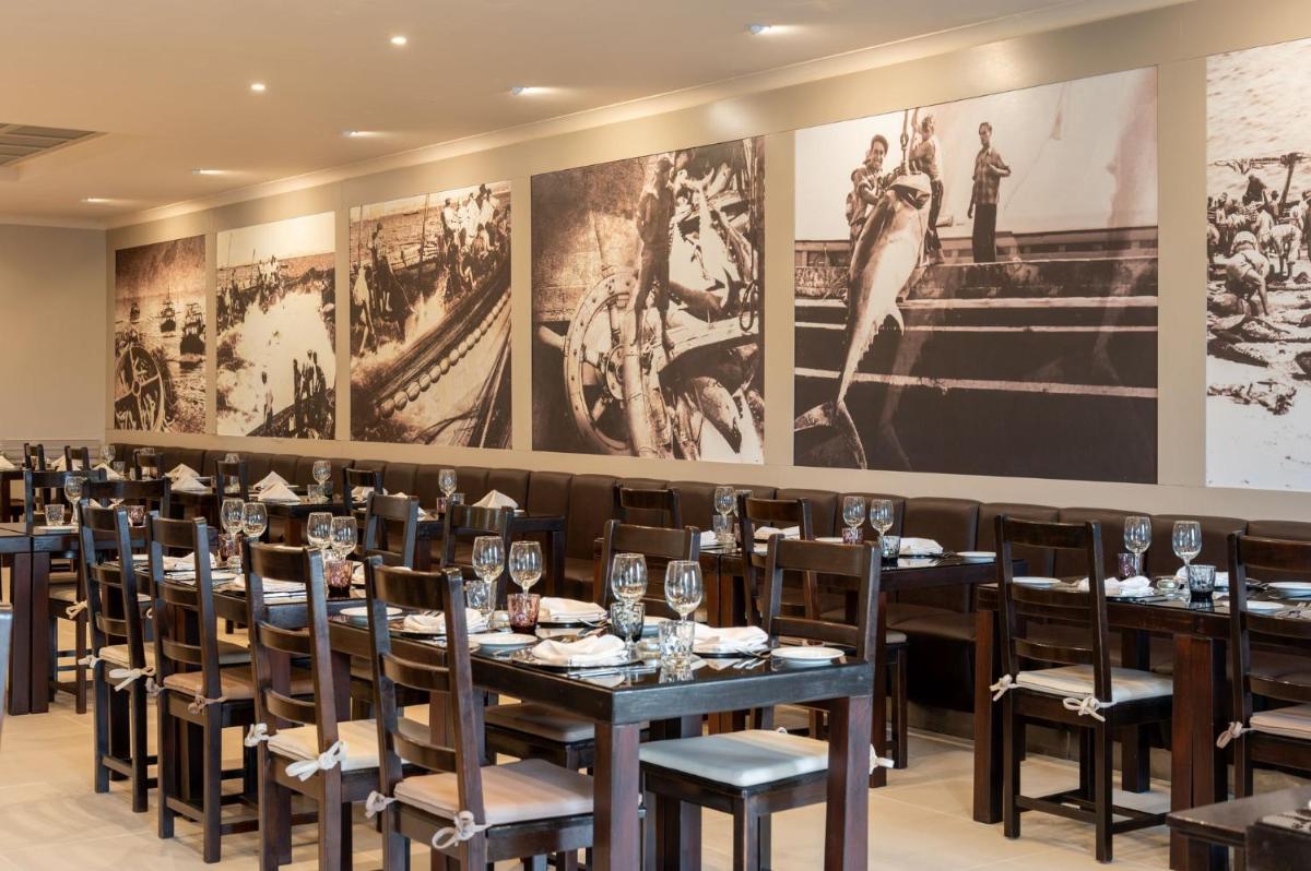 Um restaurante ou outro lugar para comer em Vila Gale Albacora