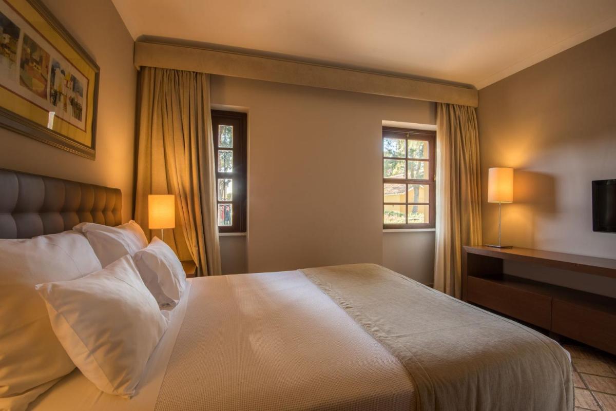 Uma cama ou camas num quarto em Vila Gale Albacora