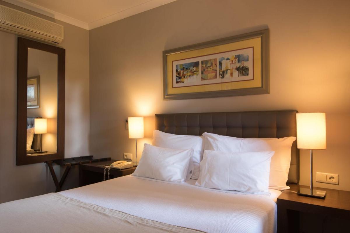 Uma cama ou camas num quarto em Vila Gale Albacora