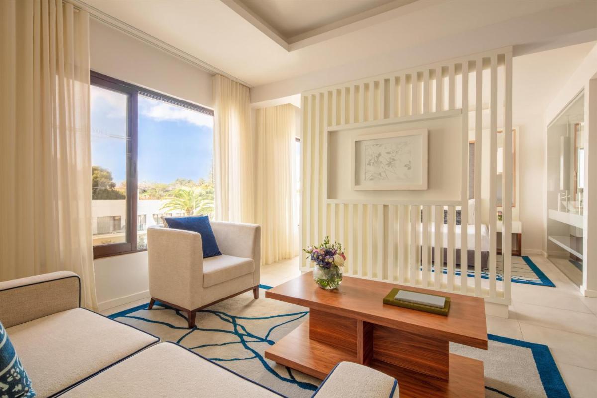 Uma cama ou camas num quarto em Tivoli Carvoeiro