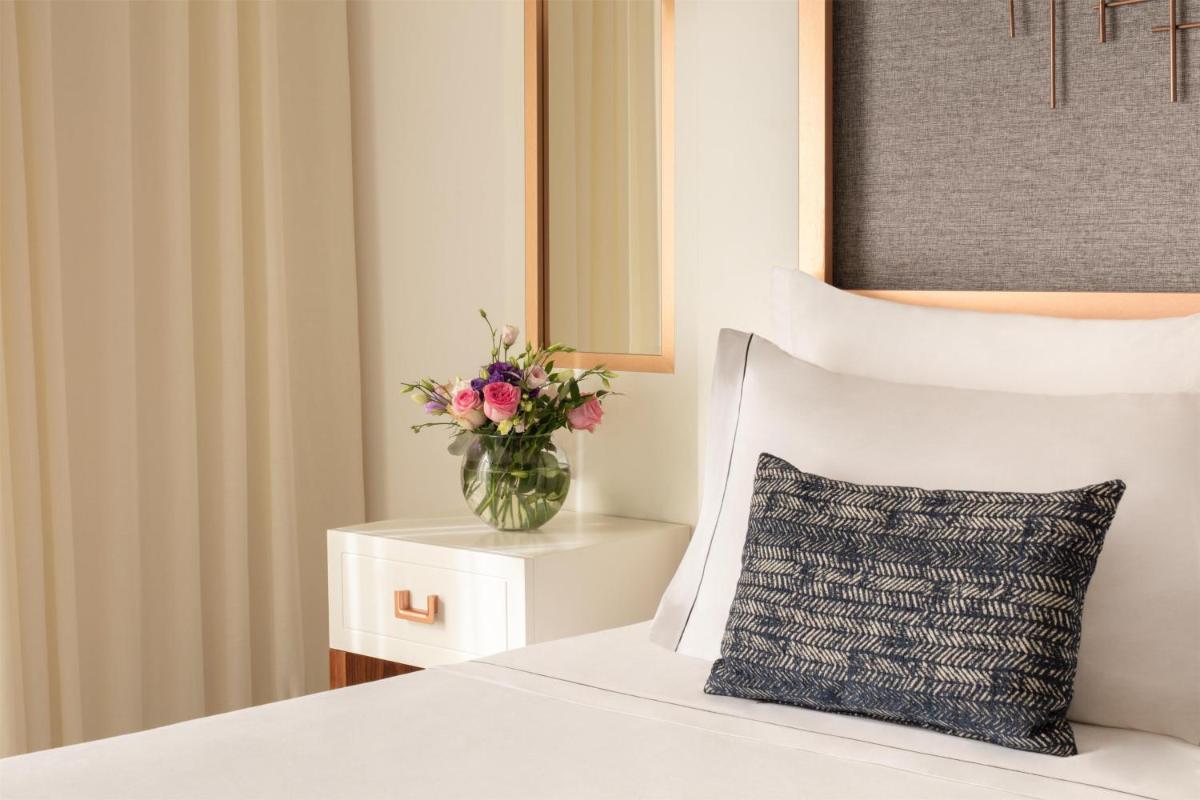 Uma cama ou camas num quarto em Tivoli Carvoeiro
