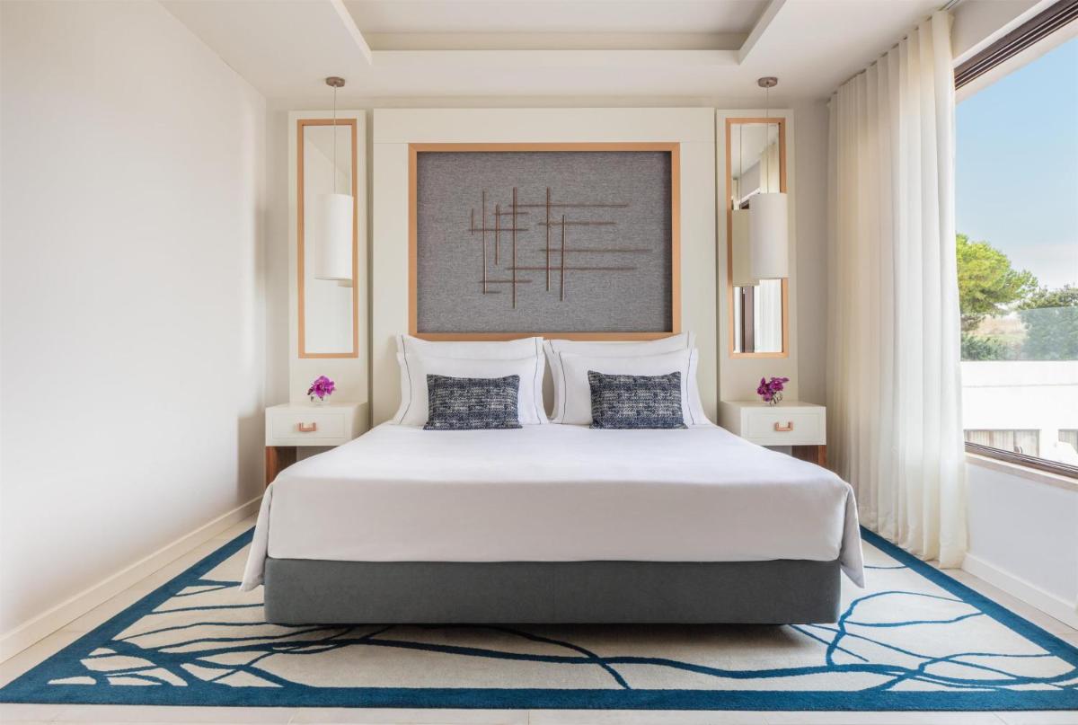 Uma cama ou camas num quarto em Tivoli Carvoeiro