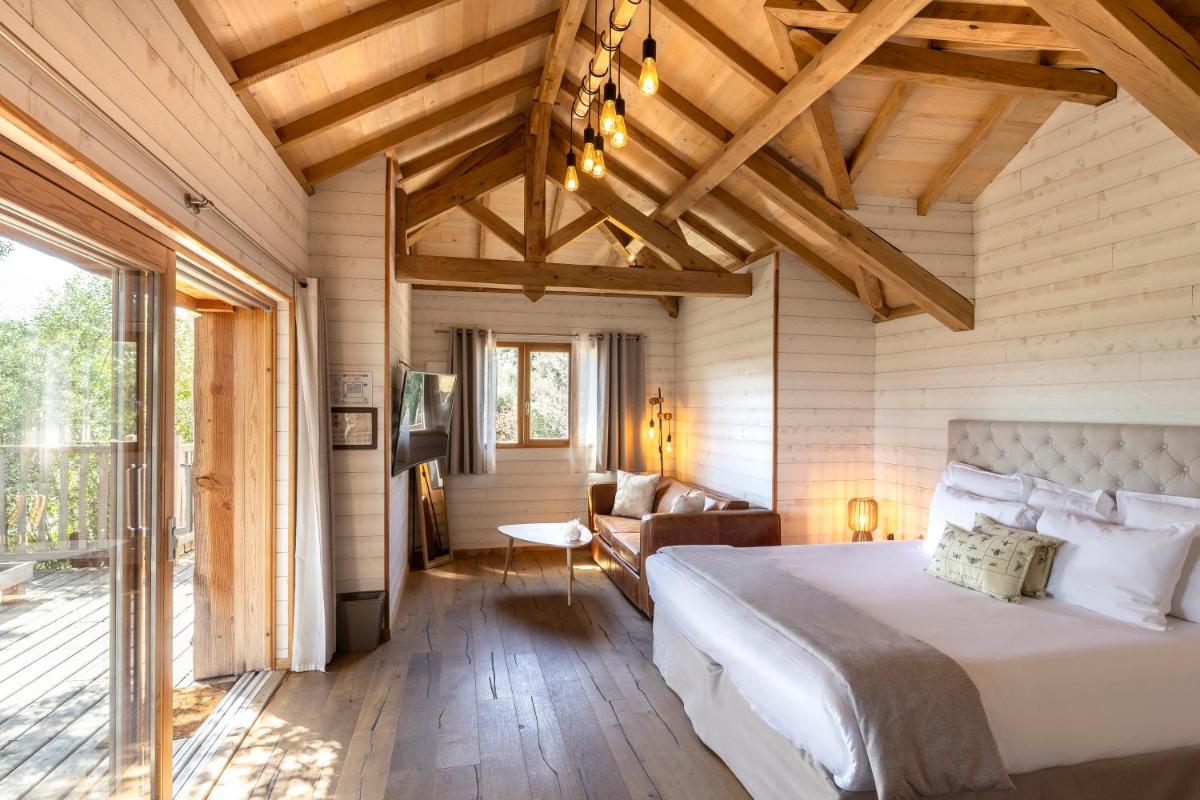 Un ou plusieurs lits dans un hébergement de l'établissement L'Hostellerie du Moulin des Oliviers