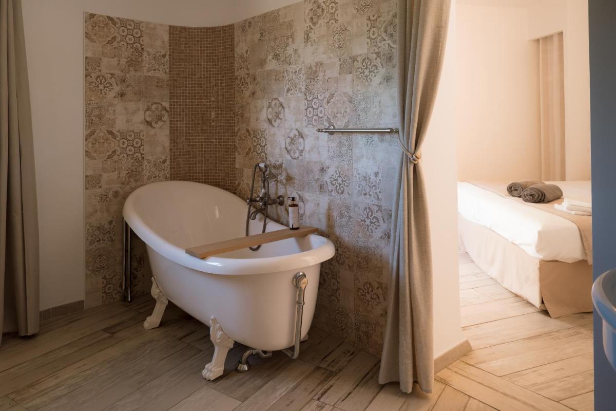 Salle de bains dans l'établissement L'Hostellerie du Moulin des Oliviers