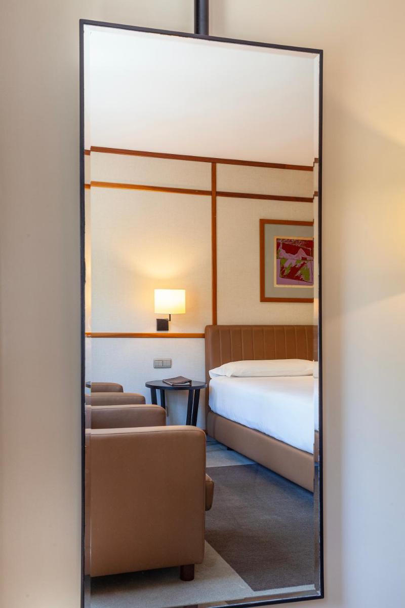 Uma cama ou camas num quarto em Hotel de Guimaraes Business & SPA