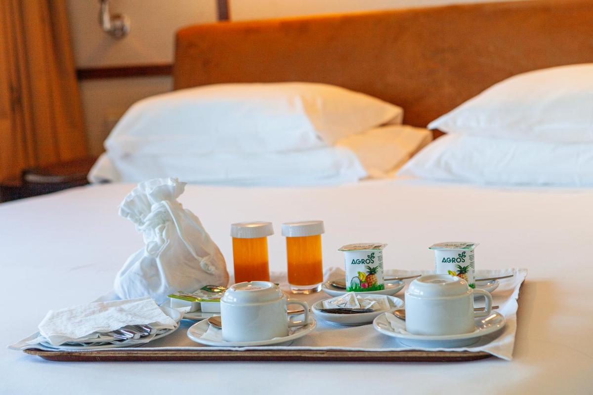 Uma cama ou camas num quarto em Hotel de Guimaraes Business & SPA