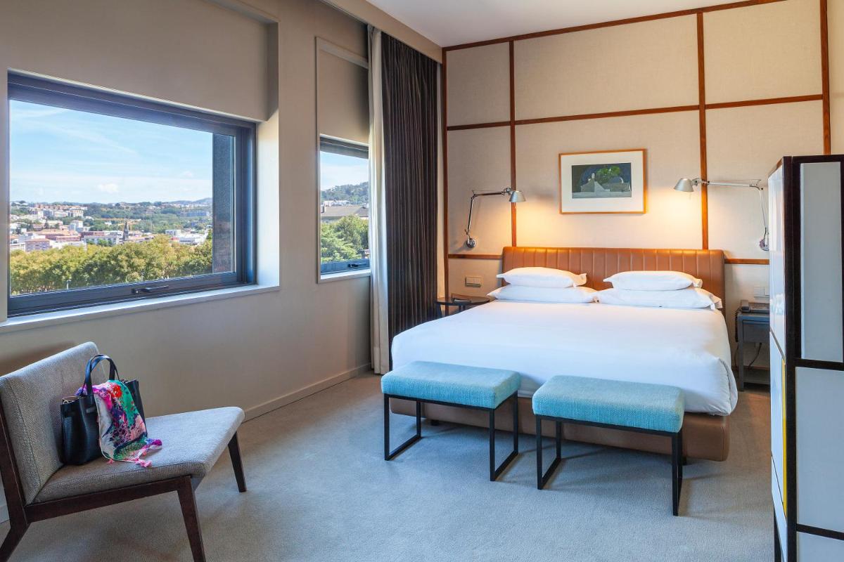 Uma cama ou camas num quarto em Hotel de Guimaraes Business & SPA