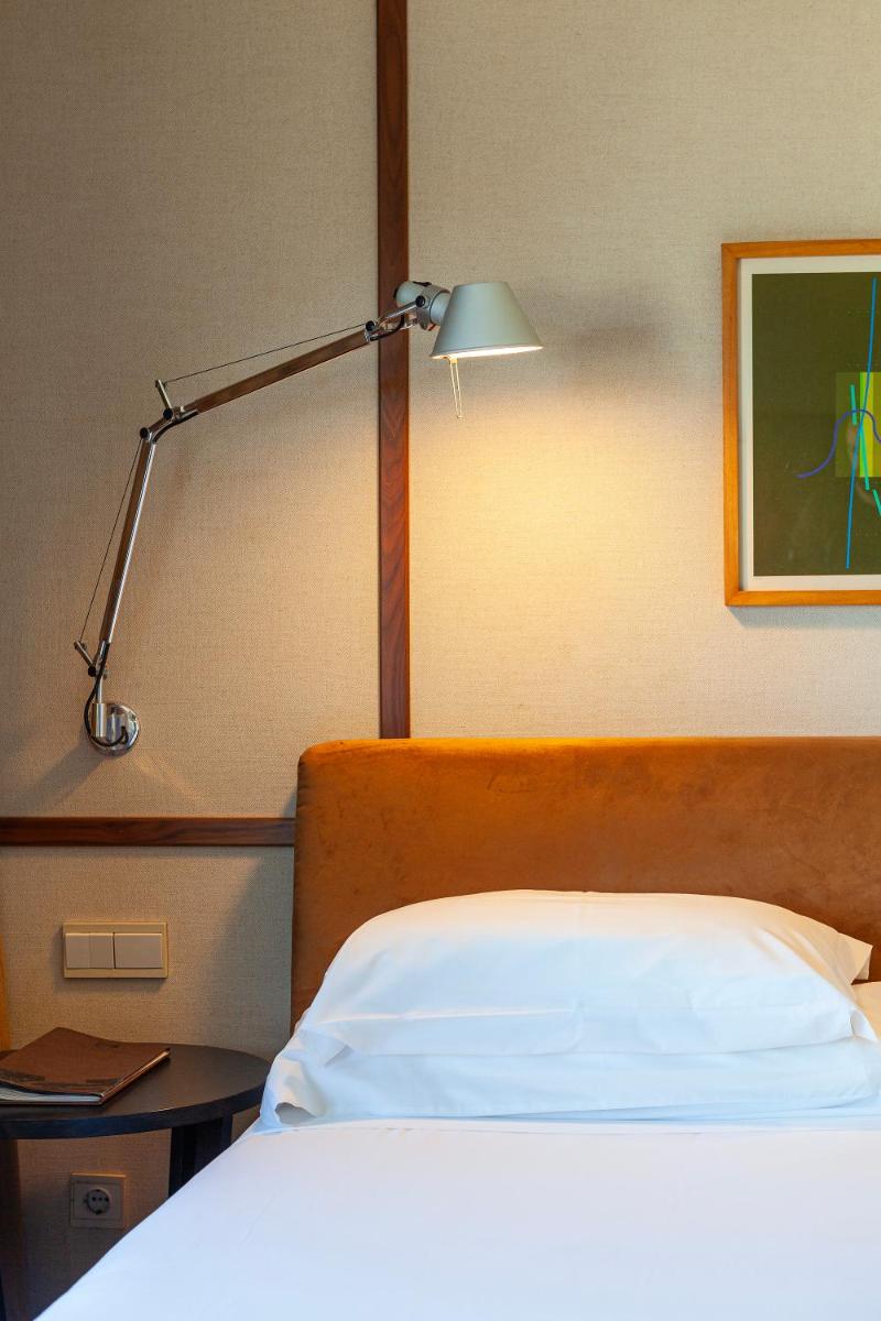 Uma cama ou camas num quarto em Hotel de Guimaraes Business & SPA