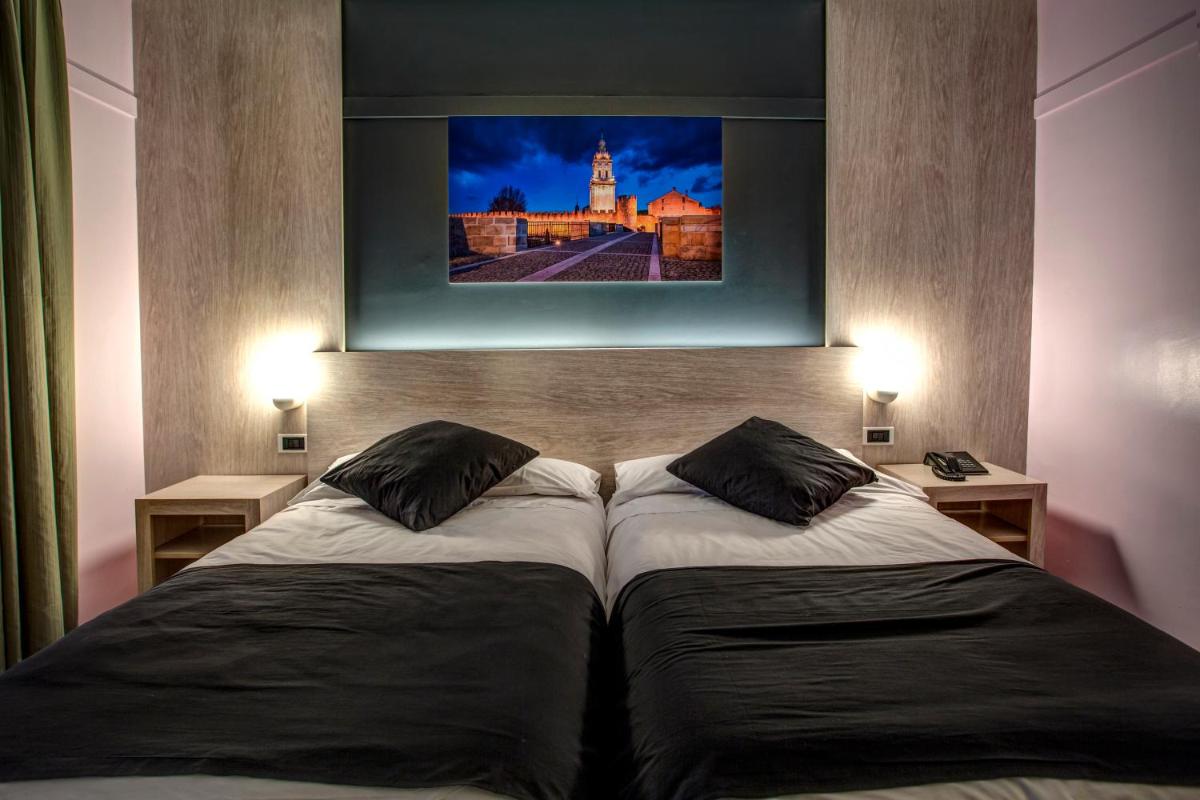 Cama o camas de una habitación en Hotel Spa Rio Ucero