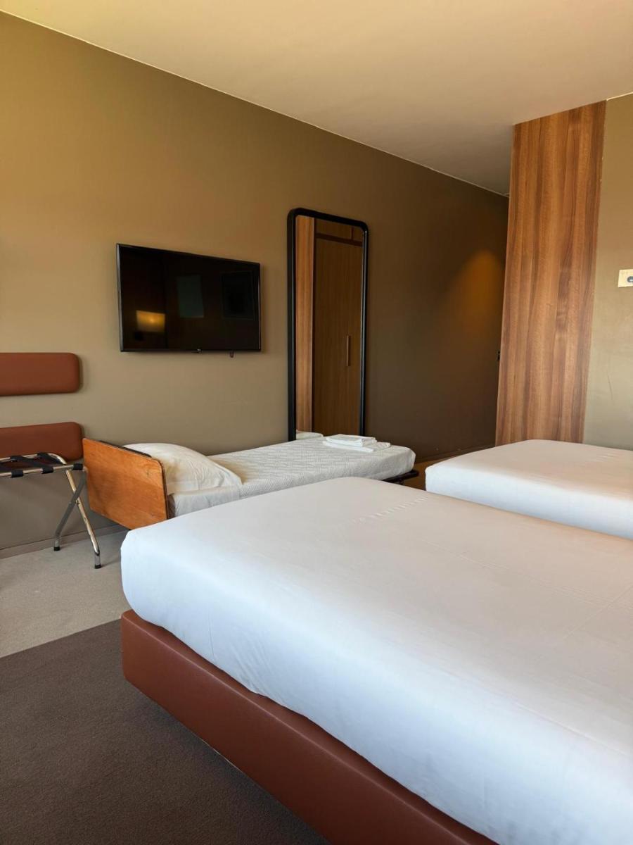 Uma cama ou camas num quarto em Hotel de Guimaraes Business & SPA