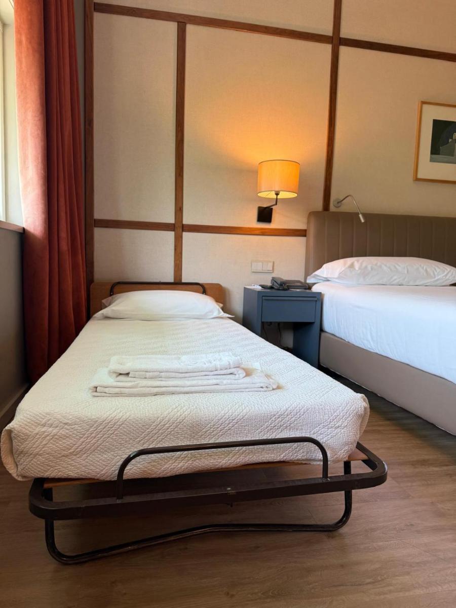 Uma cama ou camas num quarto em Hotel de Guimaraes Business & SPA