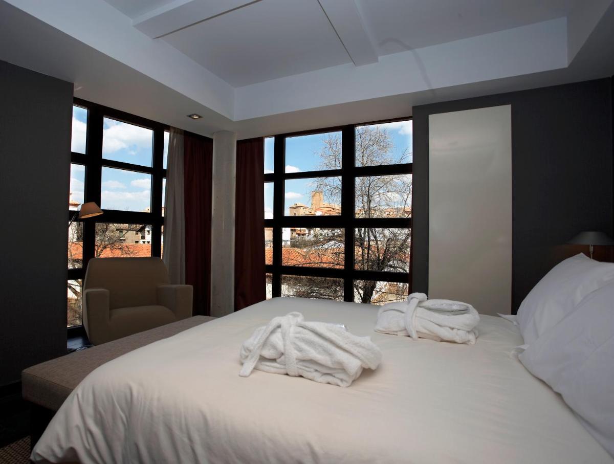 Cama o camas de una habitación en Hotel La Trufa Negra