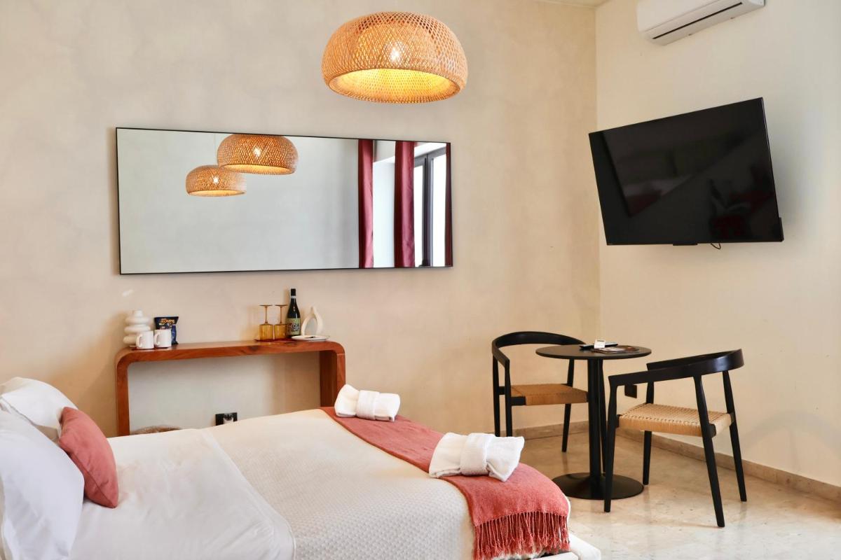 Taga Suites - Housity