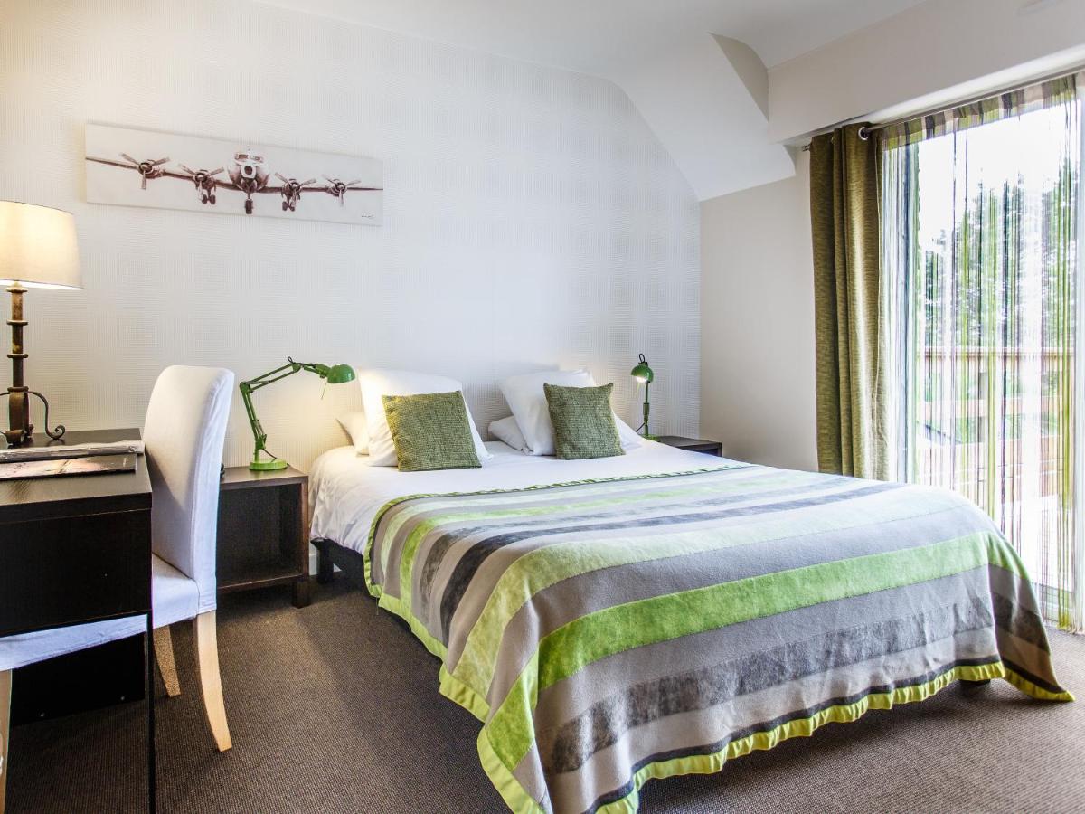 Un ou plusieurs lits dans un hébergement de l'établissement Carnac Lodge Hotel & Spa