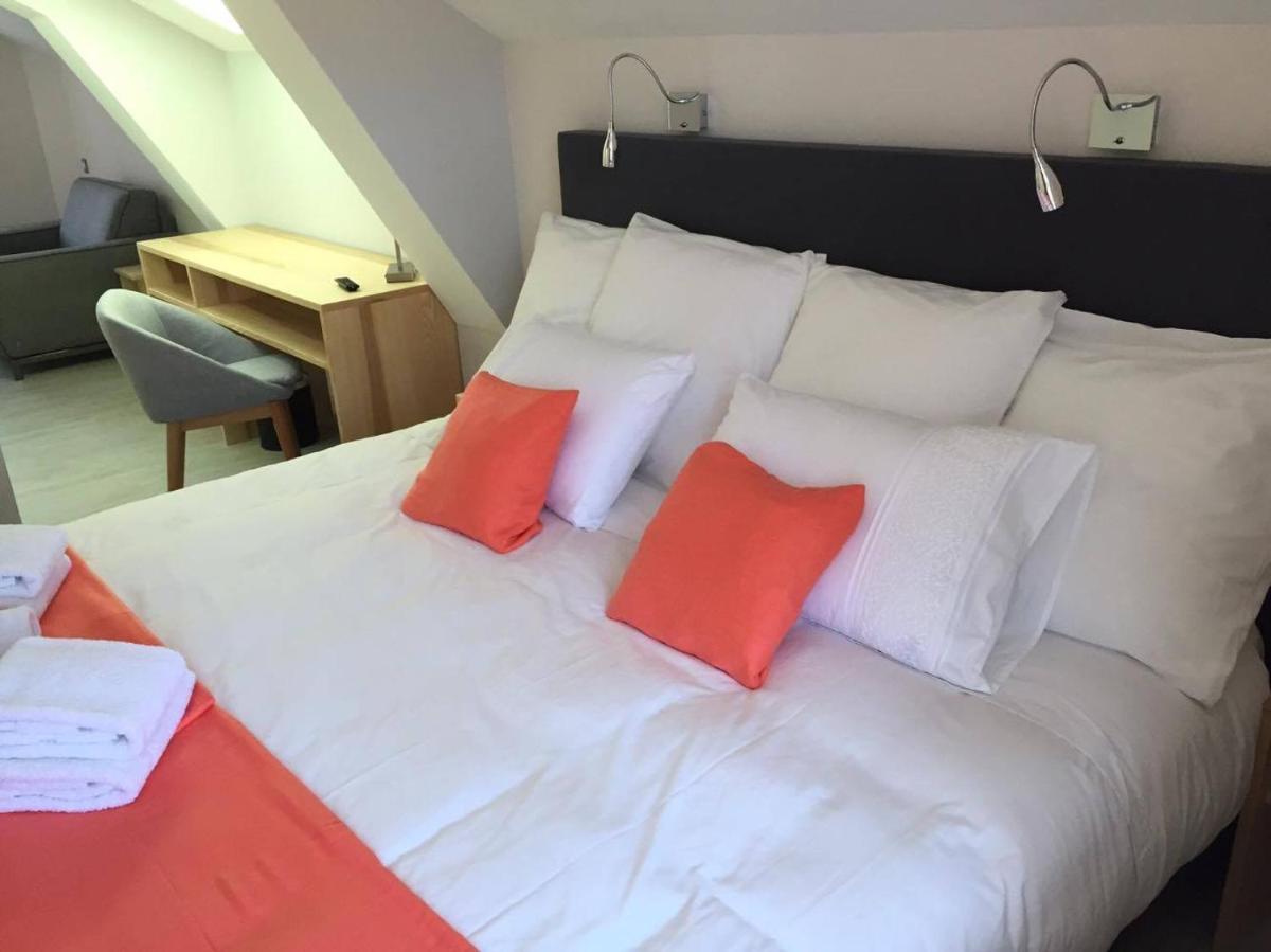 Un ou plusieurs lits dans un hébergement de l'établissement Hôtel du Bout du Monde