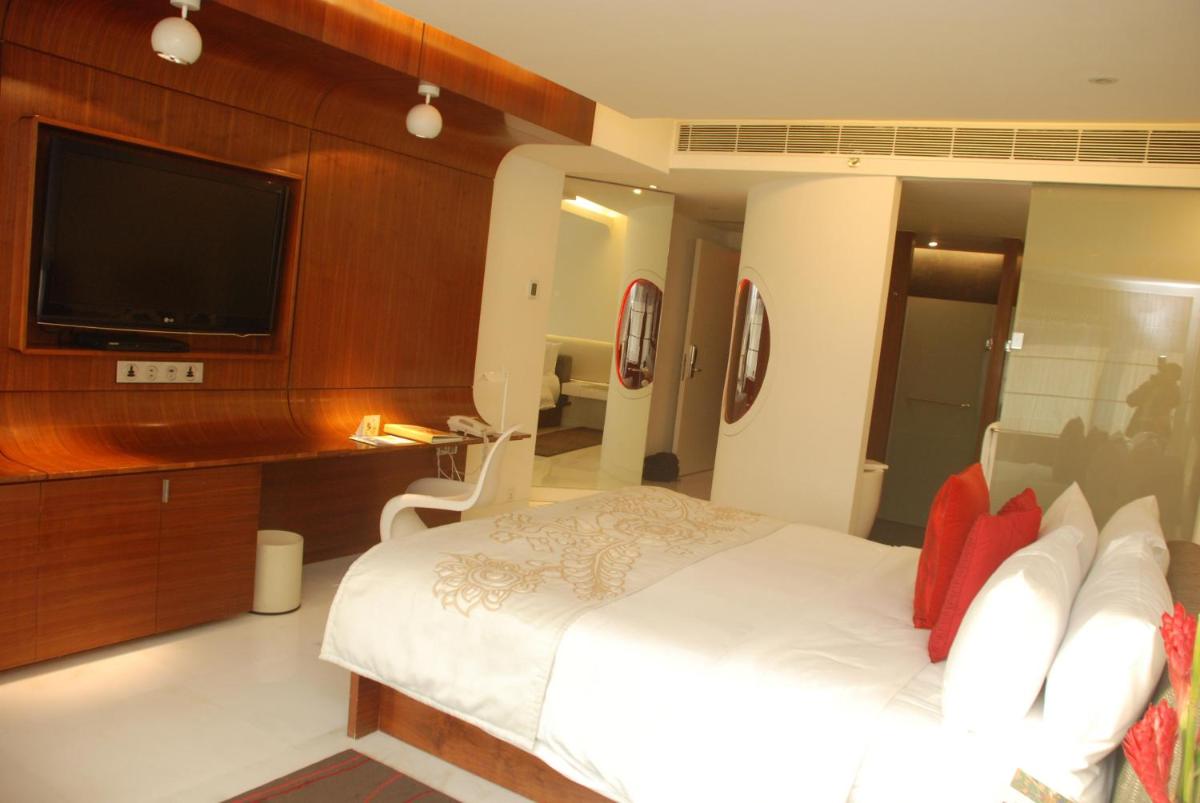 a bedroom with a bed and a flat screen tv at The Park Hyderabad, Banjara Hills near Hussain Sagar Lake in Hyderabad a bedroom with a bed and a flat screen tv at The Park Hyderabad, Banjara Hills near Hussain Sagar Lake in Hyderabad