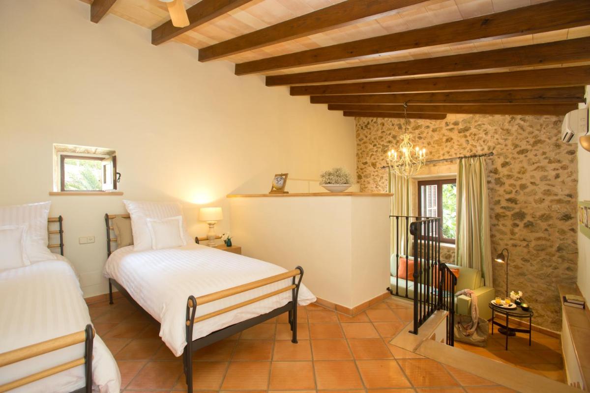 Cama o camas de una habitación en Casa Font i Roig