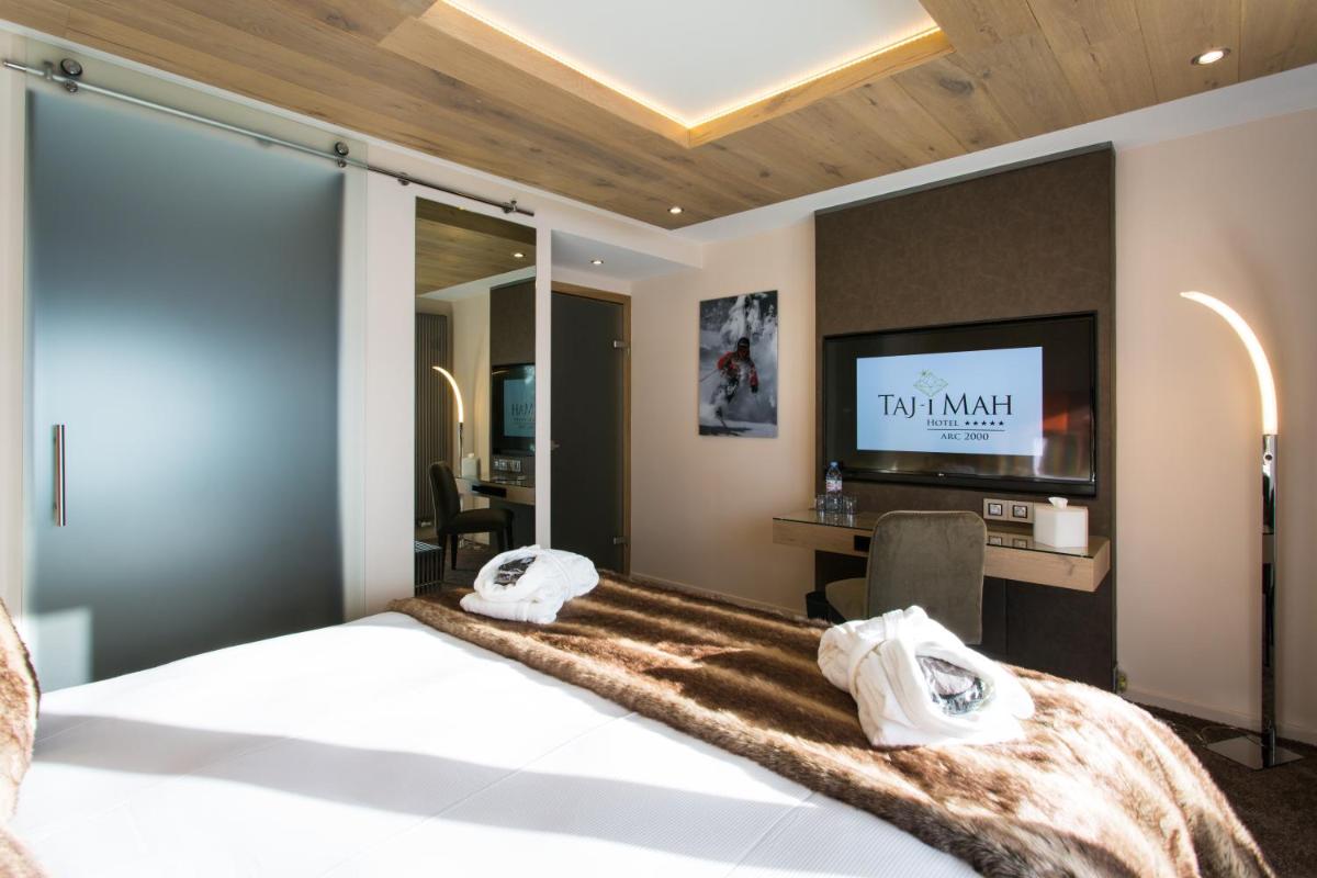 Un ou plusieurs lits dans un hébergement de l'établissement Hôtel Taj-I Mah by Les Etincelles