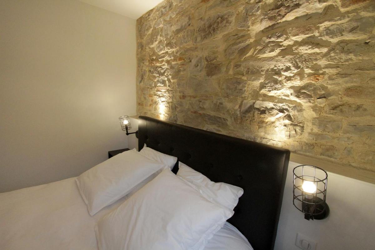 Un ou plusieurs lits dans un hébergement de l'établissement Le Moulin d'Oscar & Spa - Mulhouse Nord