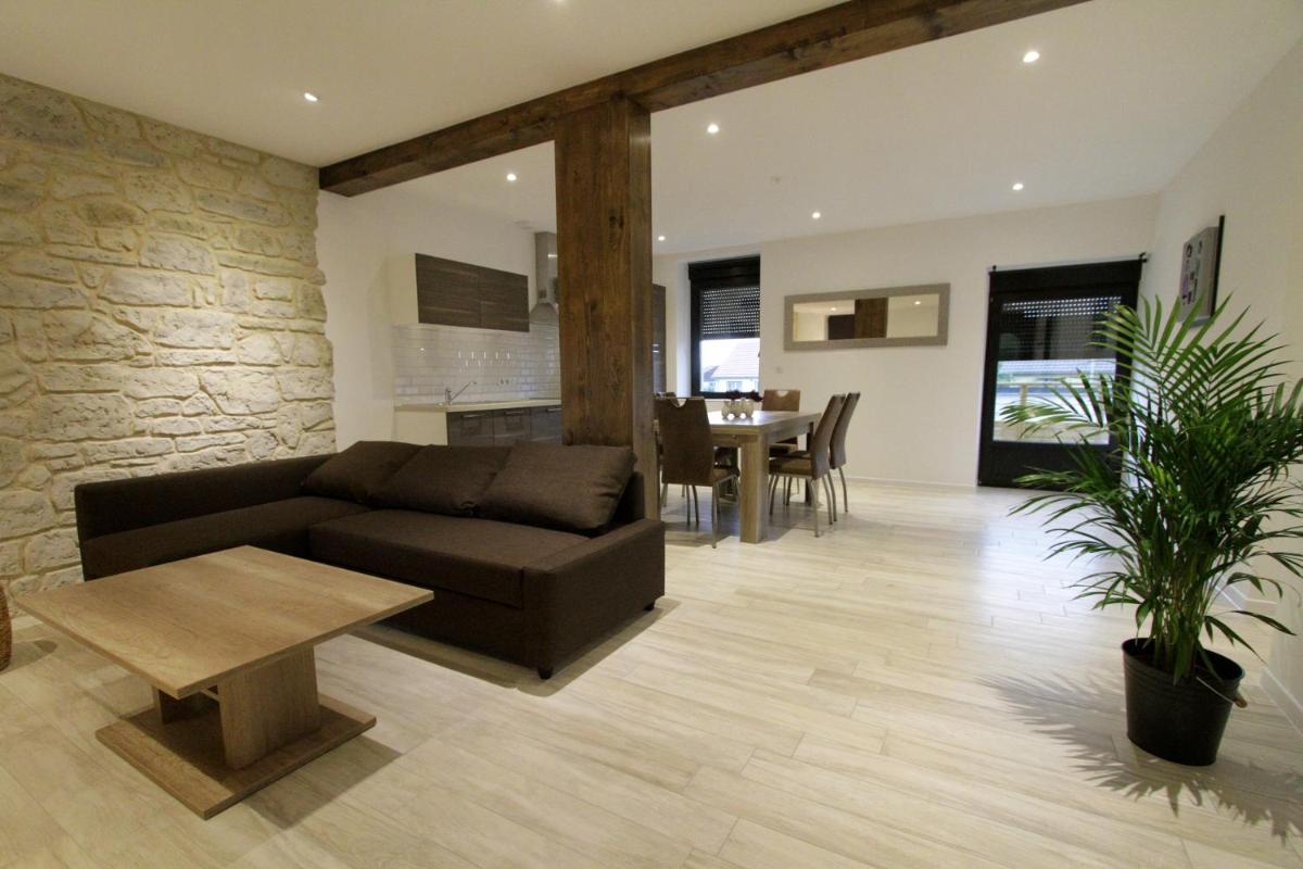 Coin salon dans l'établissement Le Moulin d'Oscar & Spa - Mulhouse Nord