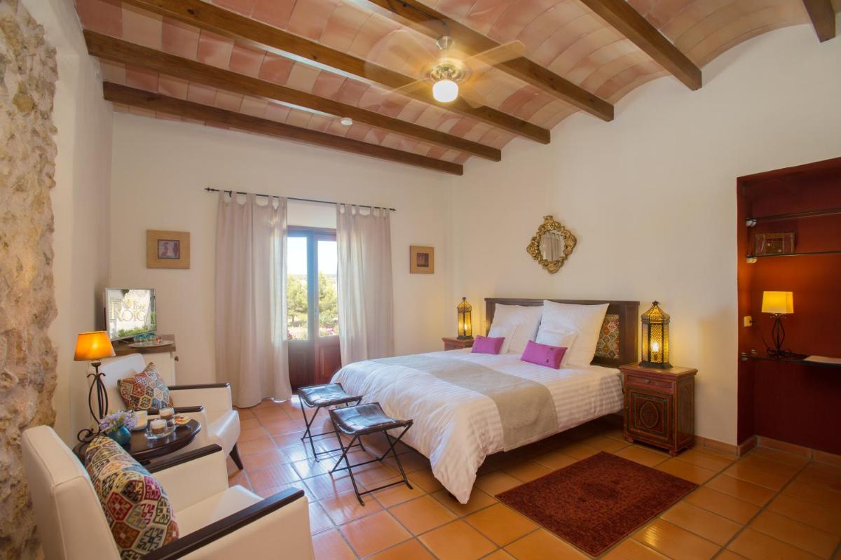 Cama o camas de una habitación en Casa Font i Roig