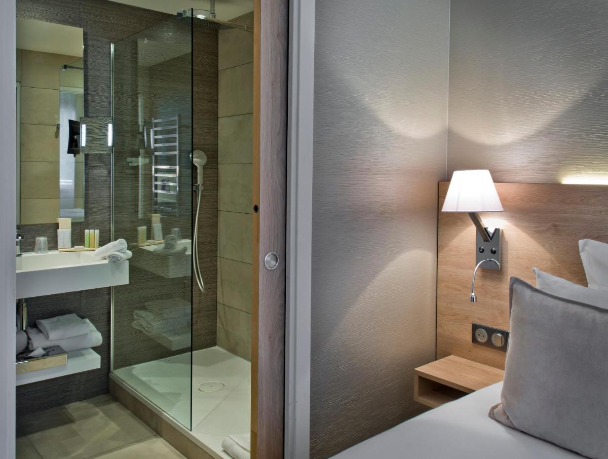 Un ou plusieurs lits dans un hébergement de l'établissement Golden Tulip Sophia Antipolis - Hotel & Spa