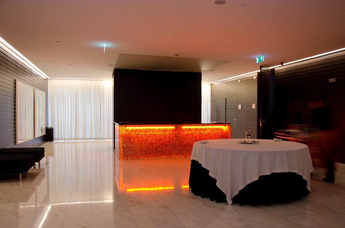 Uma cama ou camas num quarto em VIP Grand Lisboa Hotel & Spa