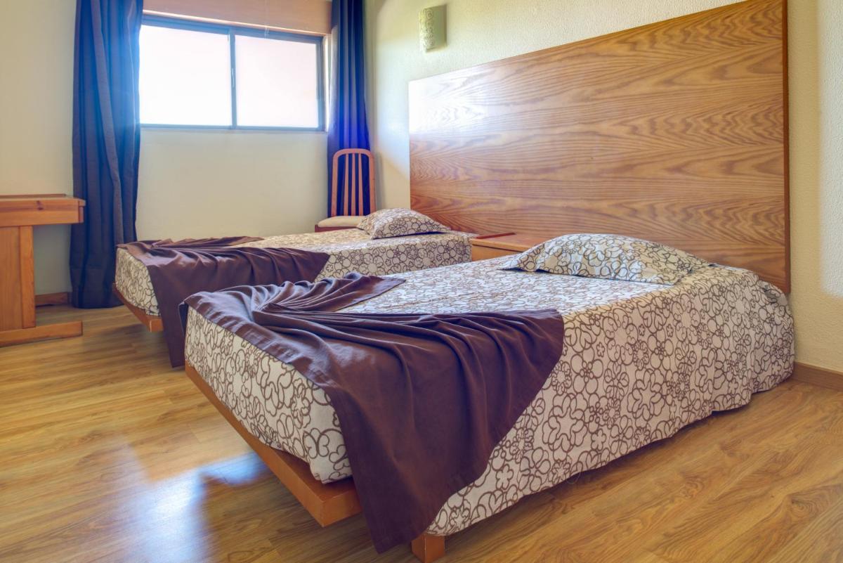 Uma cama ou camas num quarto em Choromar Apartments
