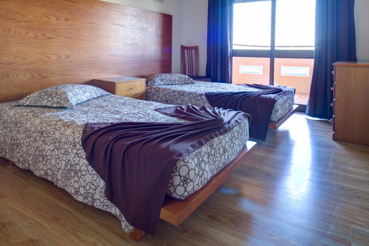 Uma cama ou camas num quarto em Choromar Apartments