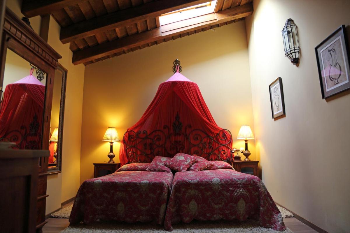 Cama o camas de una habitación en La Posada Del Canal